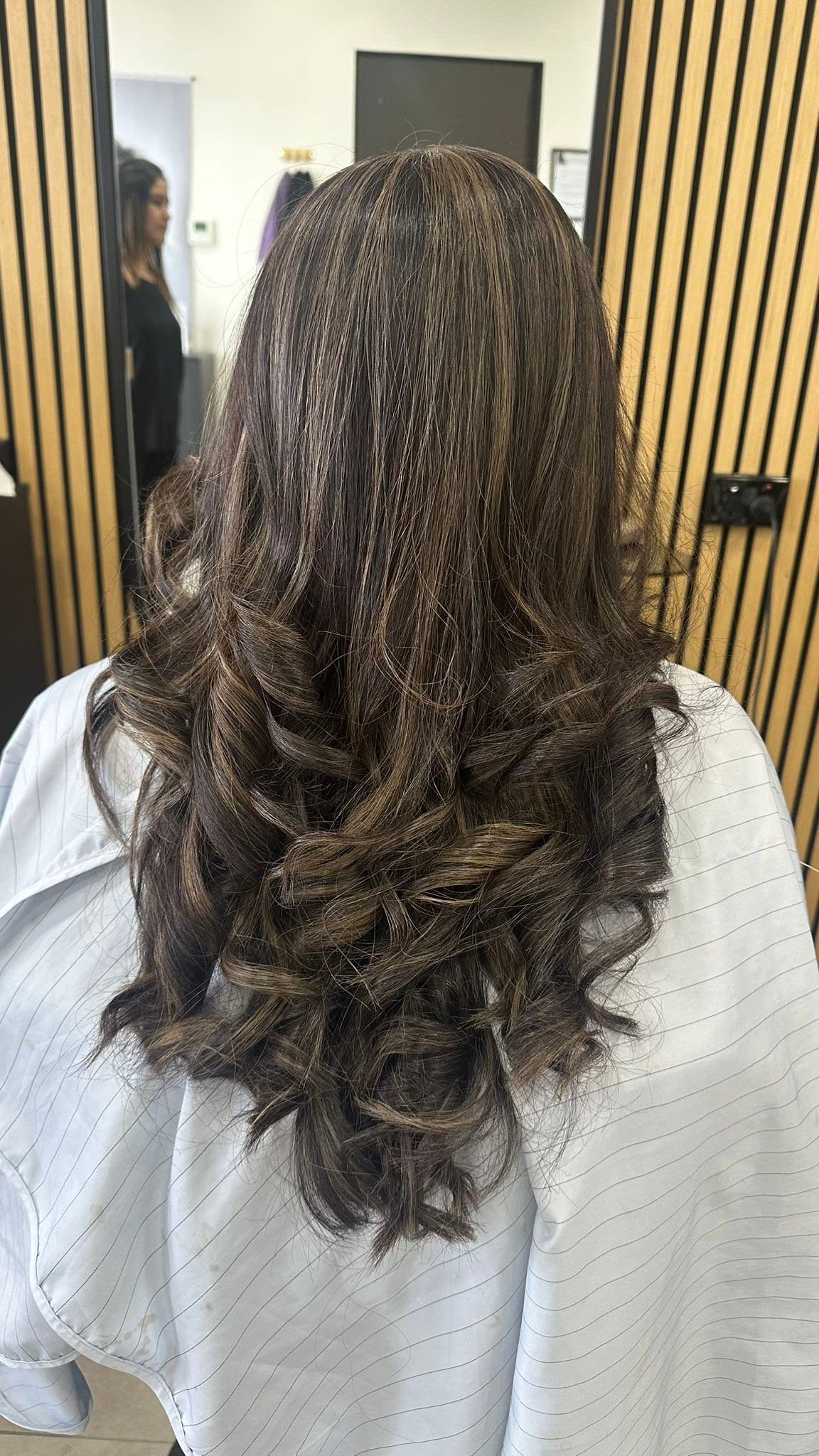 Long brown hair with soft, bouncy curls